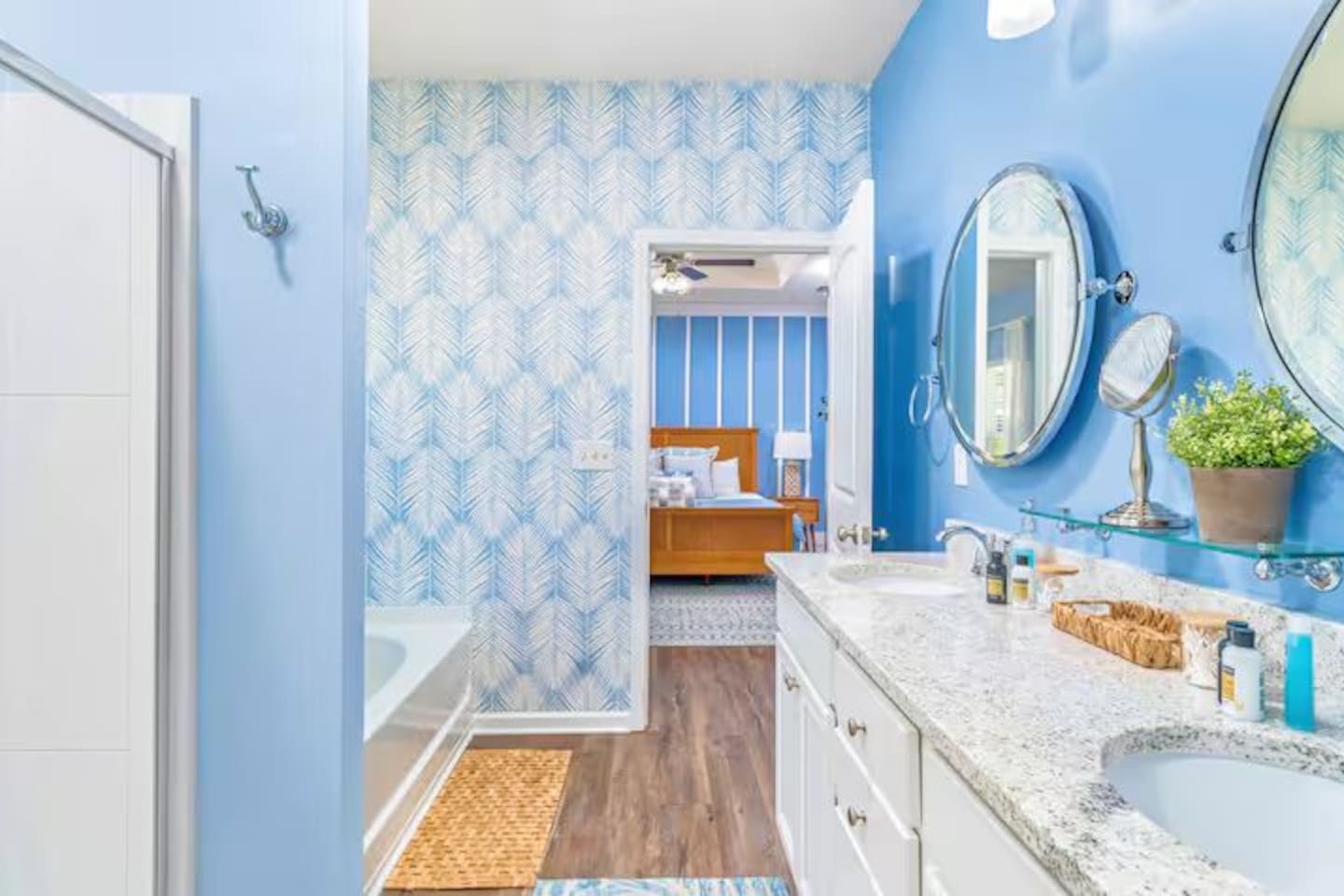 Primary Bathroom with double vanity with elegant finishes, Separate tub and walk-in shower for ultimate convenience