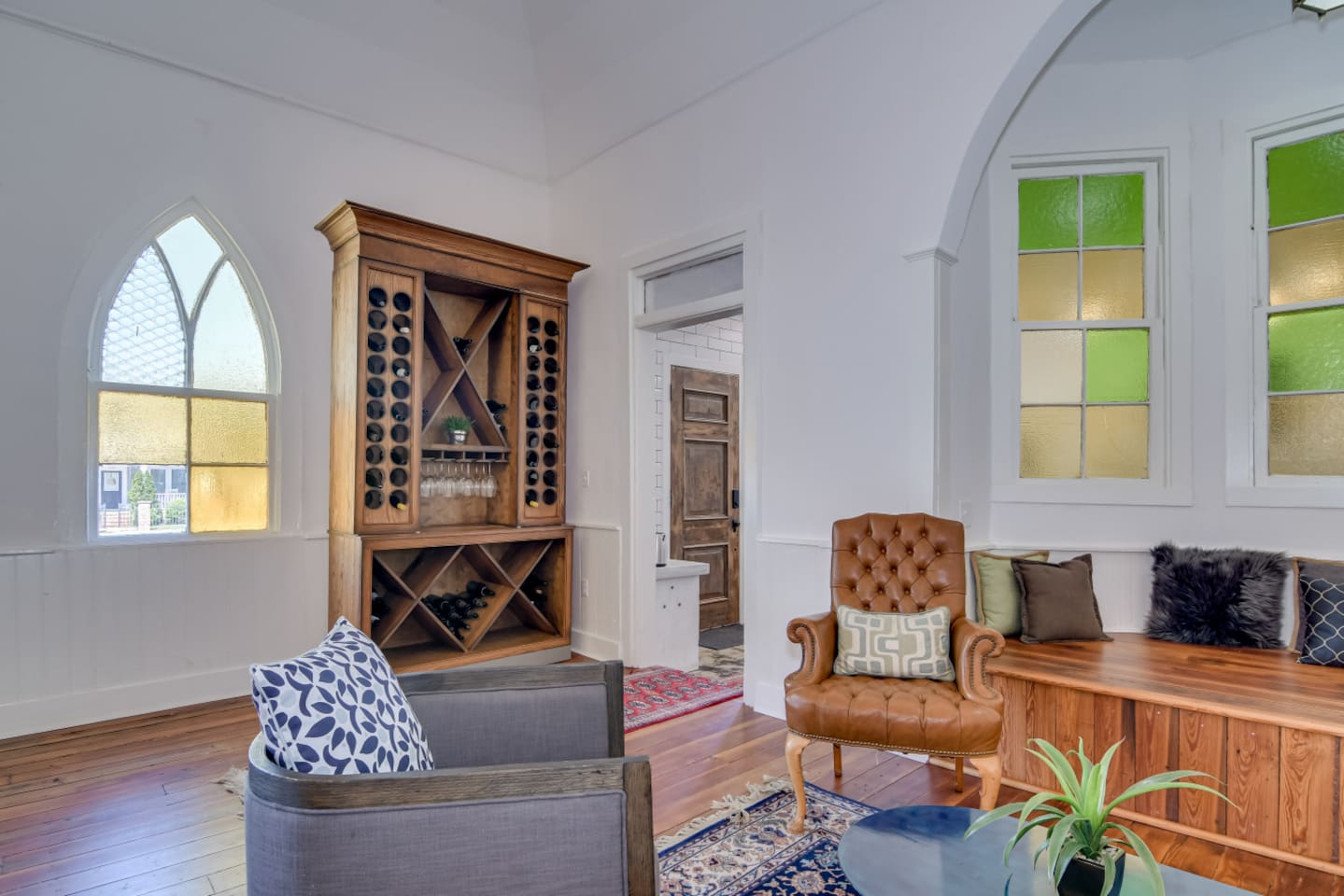 Lounge with vintage rug and mix of classic and modern décor.