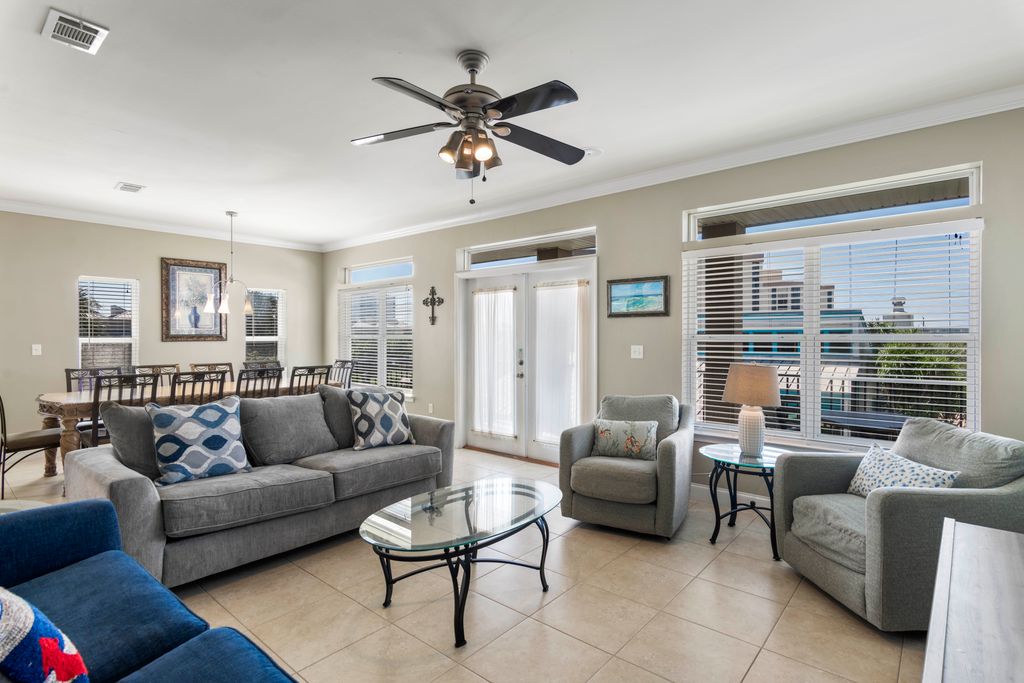 Second Floor: Living Area – Light-filled space with expansive glass window, balcony access, and plenty of natural light.
