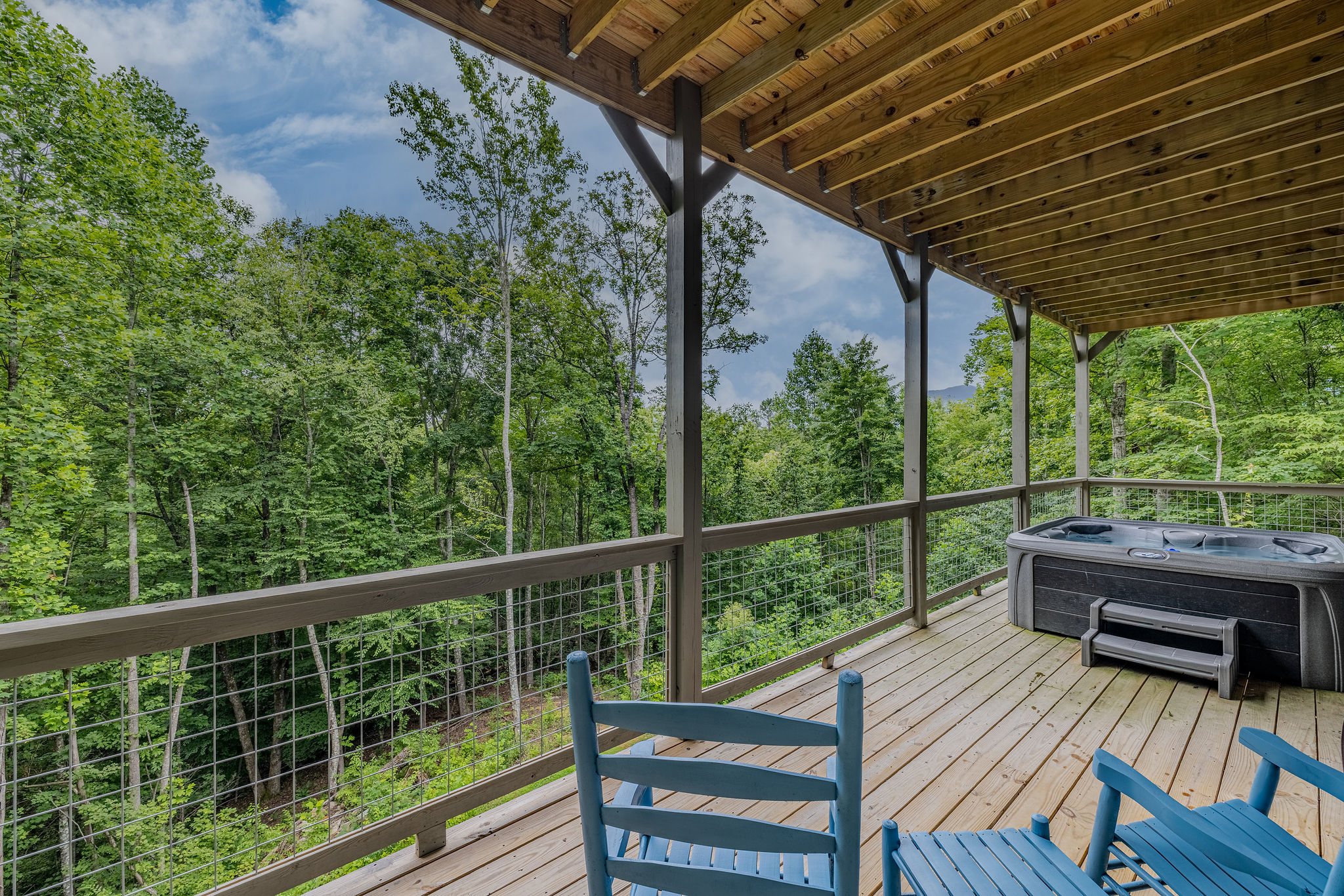 Blue Smoke Soak is a peaceful outdoor retreat for evening unwinding beneath the trees.
