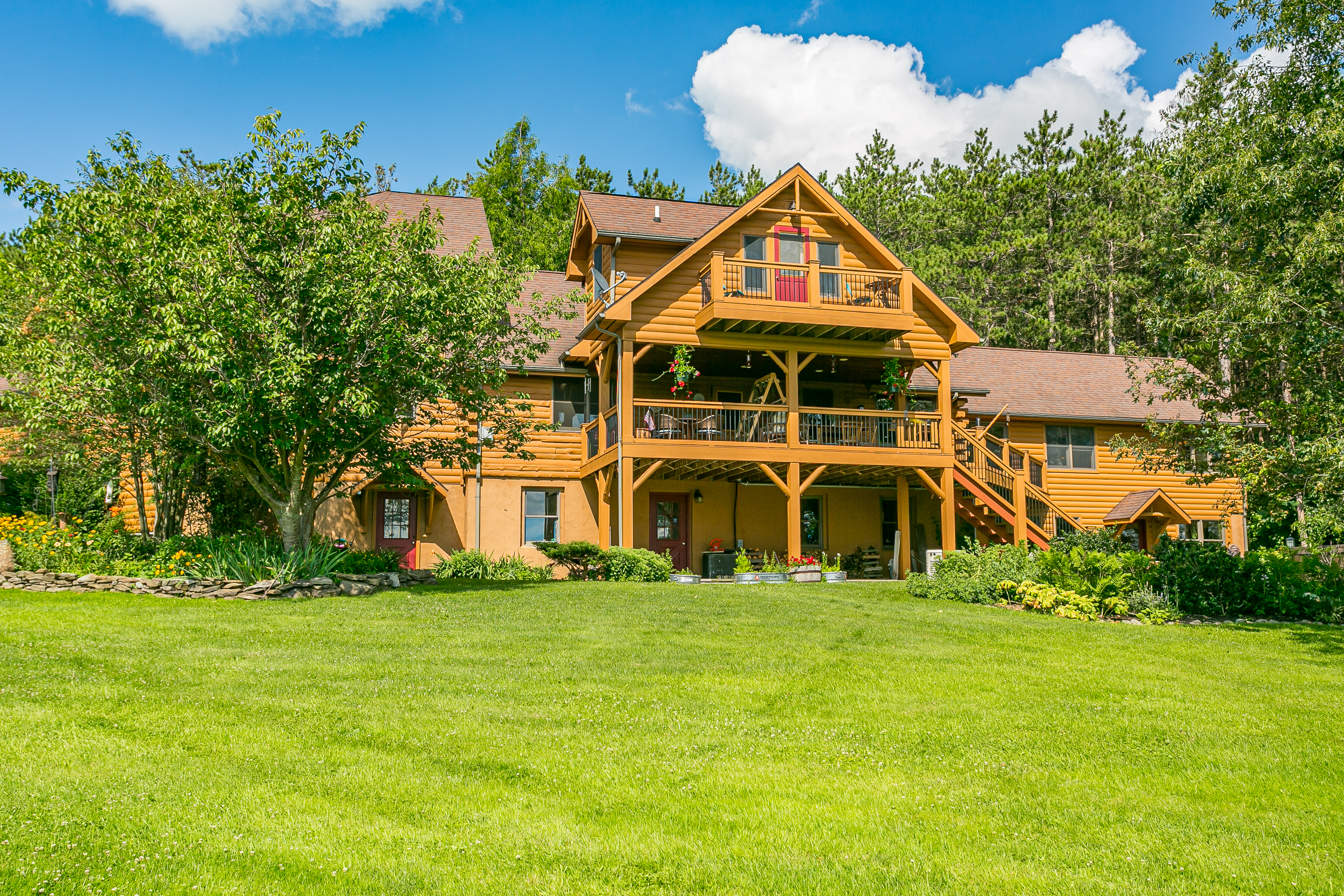 Multiple decks and porches provide sweeping views and endless spots to relax, dine, and enjoy the outdoors in style.