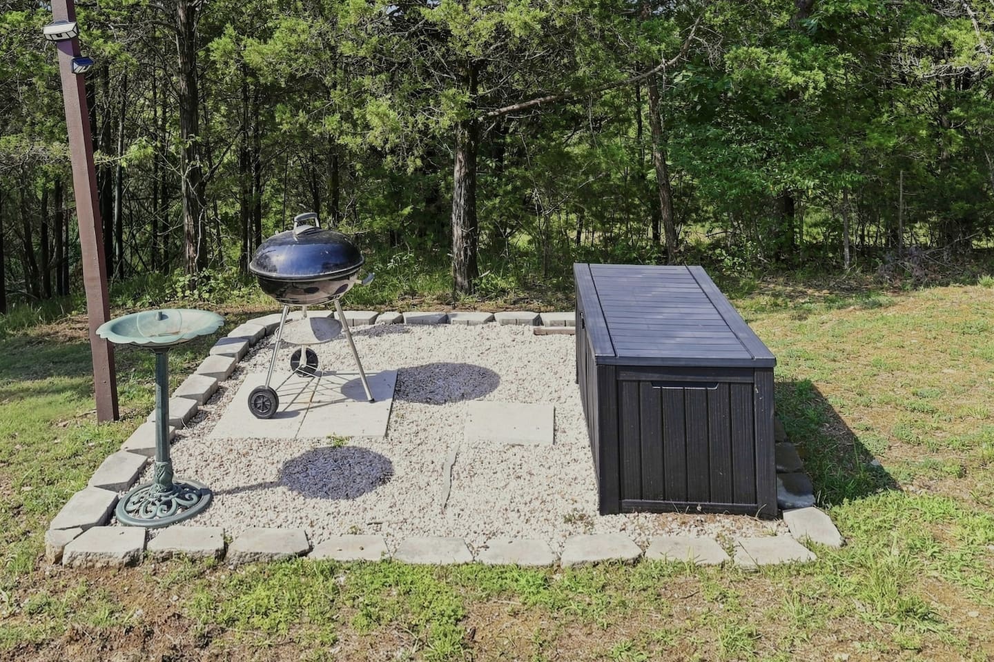 Fire up the charcoal grill for an easy cookout surrounded by the woods.