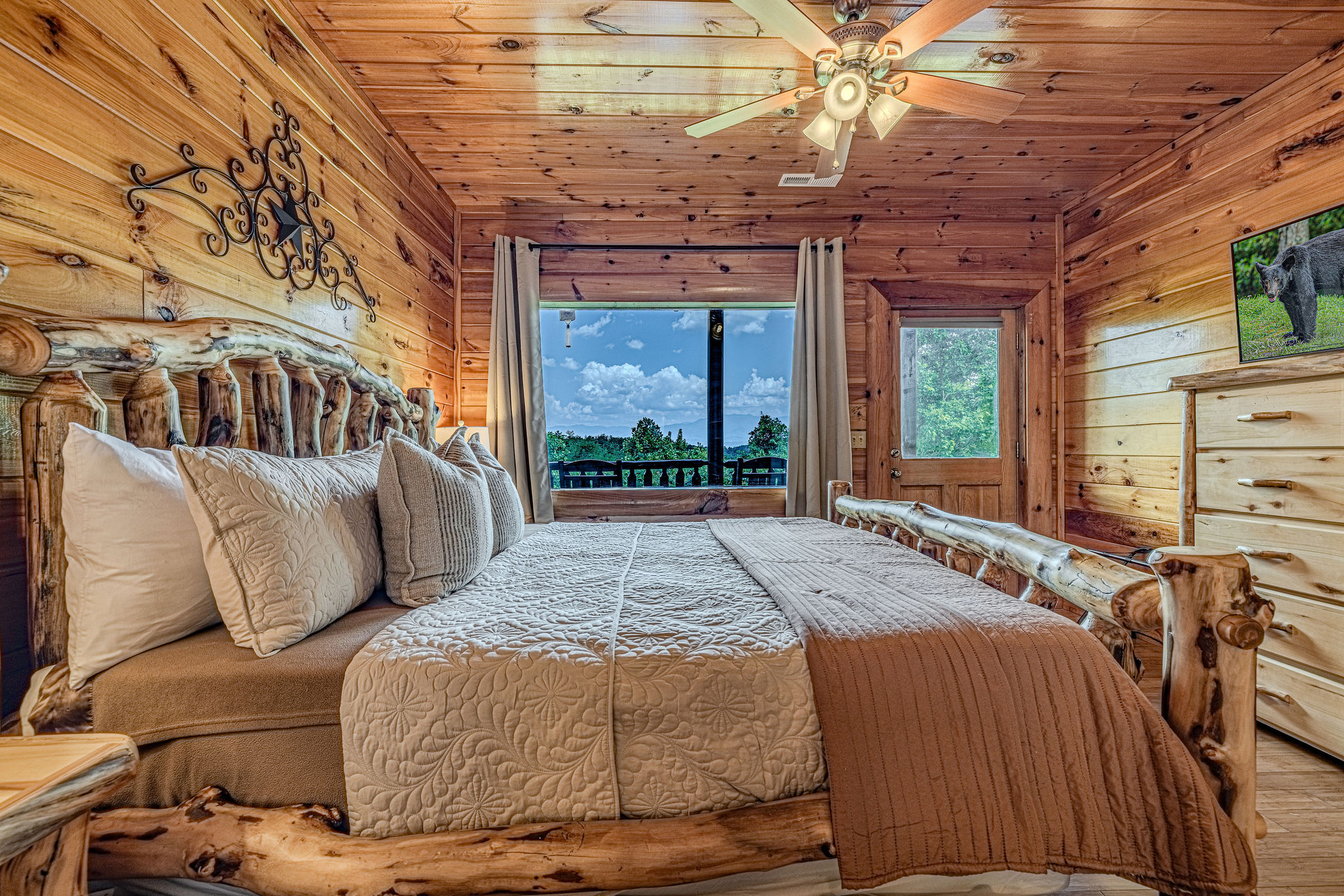 Second king suite offers private deck access, cozy electric fireplace, and smart TV with Roku, perfect year-round retreat.
