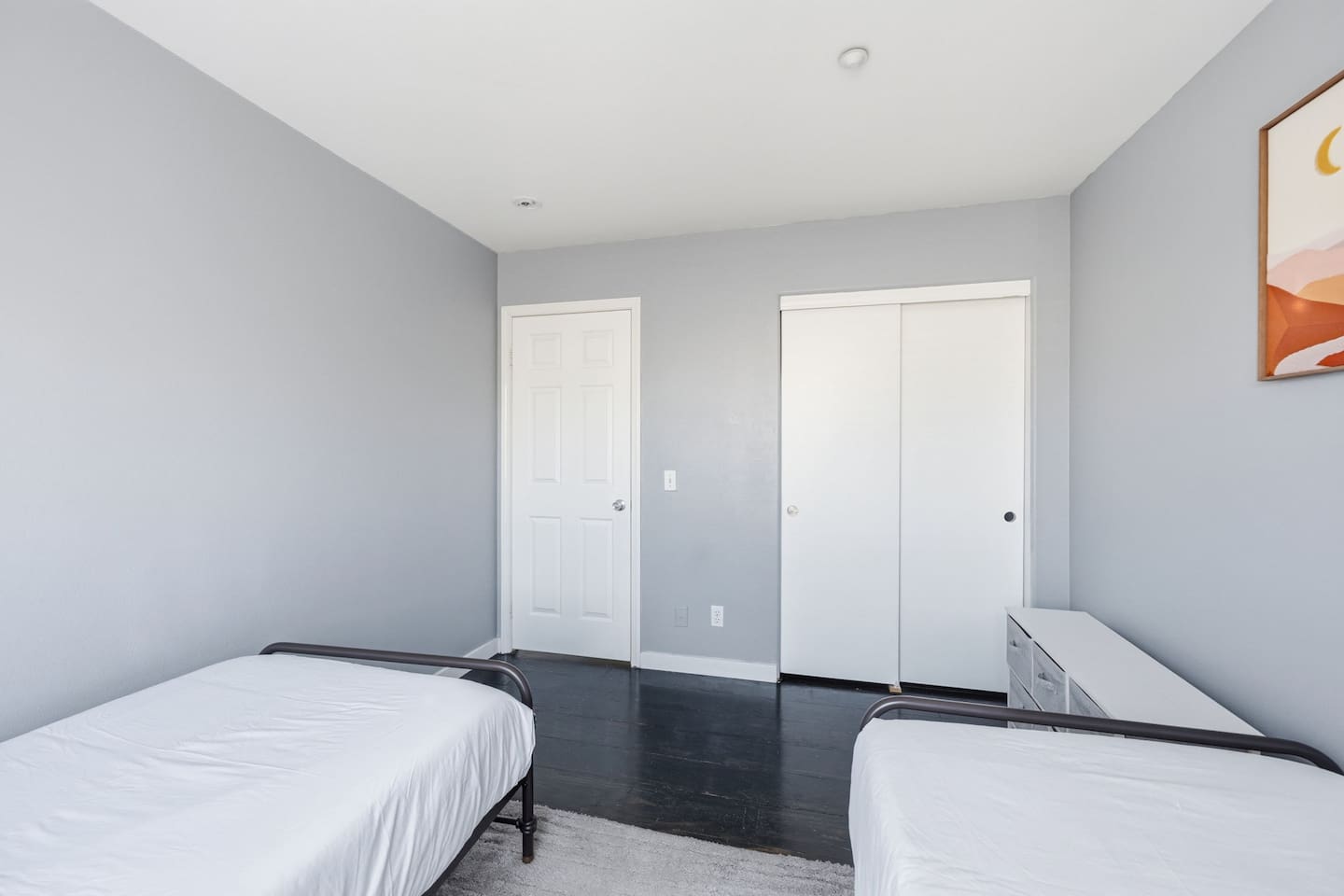 Twin beds with extra pillows, blankets, and closet storage. Quiet, private room with room-darkening shades for a full night's sleep.