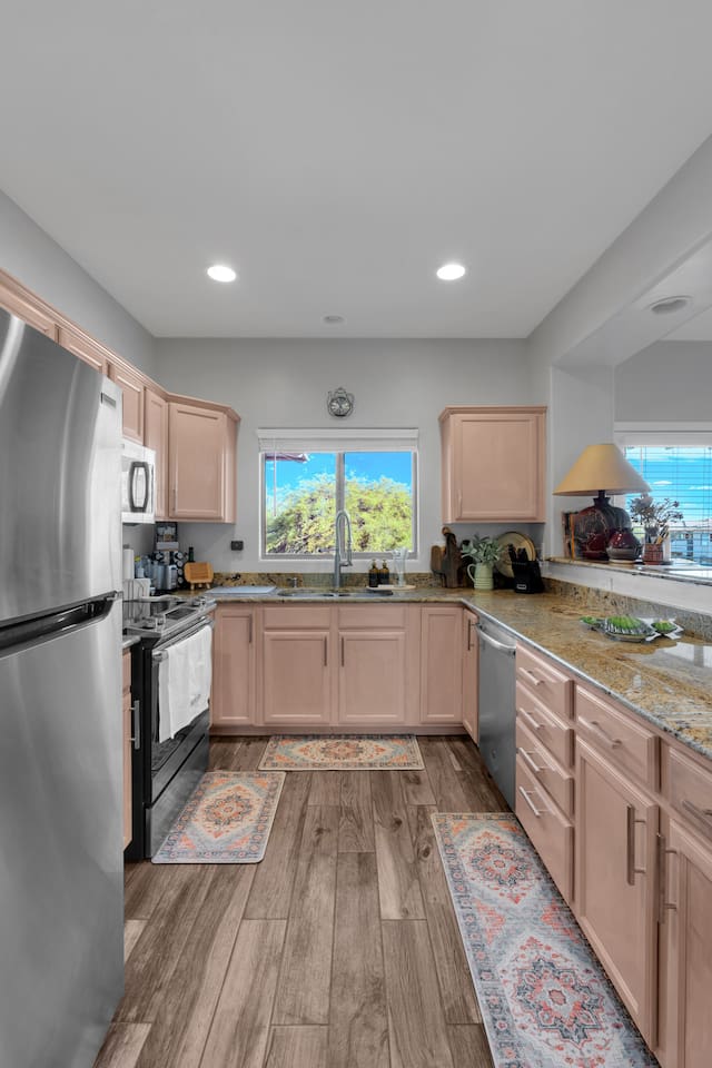 Complete kitchen with granite countertops and open view