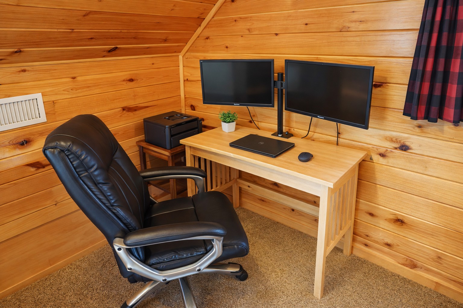 Dedicated workspace with dual monitors — ideal for remote work with lake views.