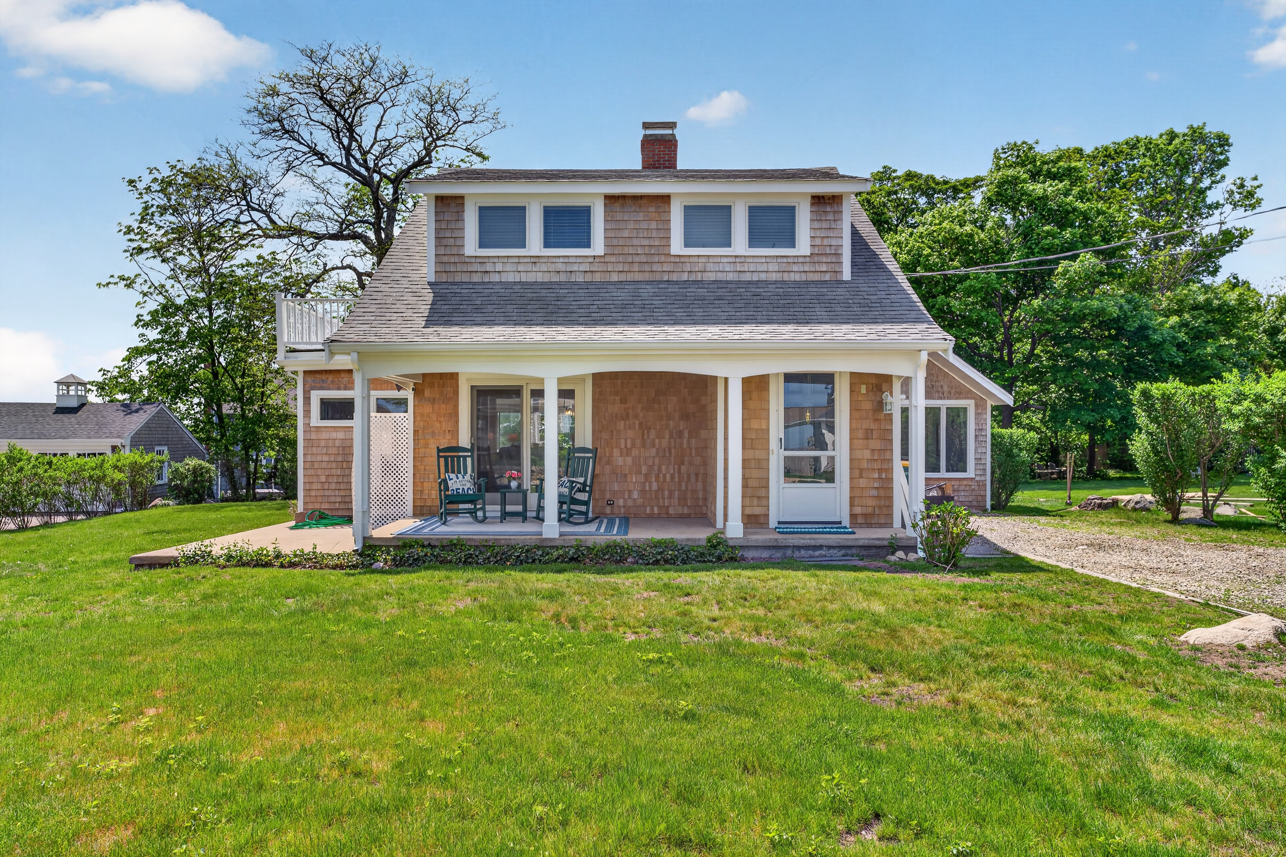 A well-maintained green yard with lush grass, offering an open outdoor space for relaxation and recreation.
