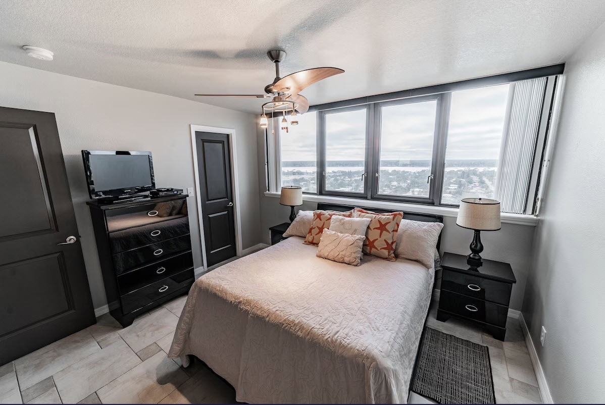 second bedroom with queen sized bed