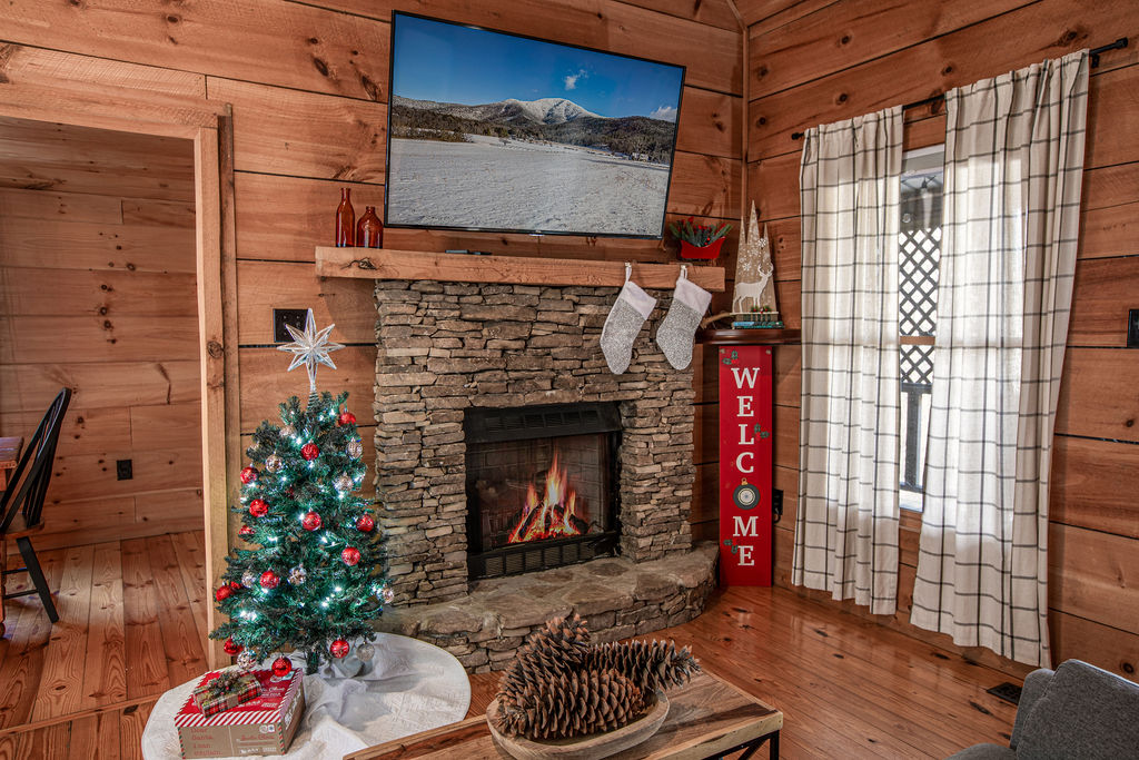 Relax by the fire with festive holiday decor.