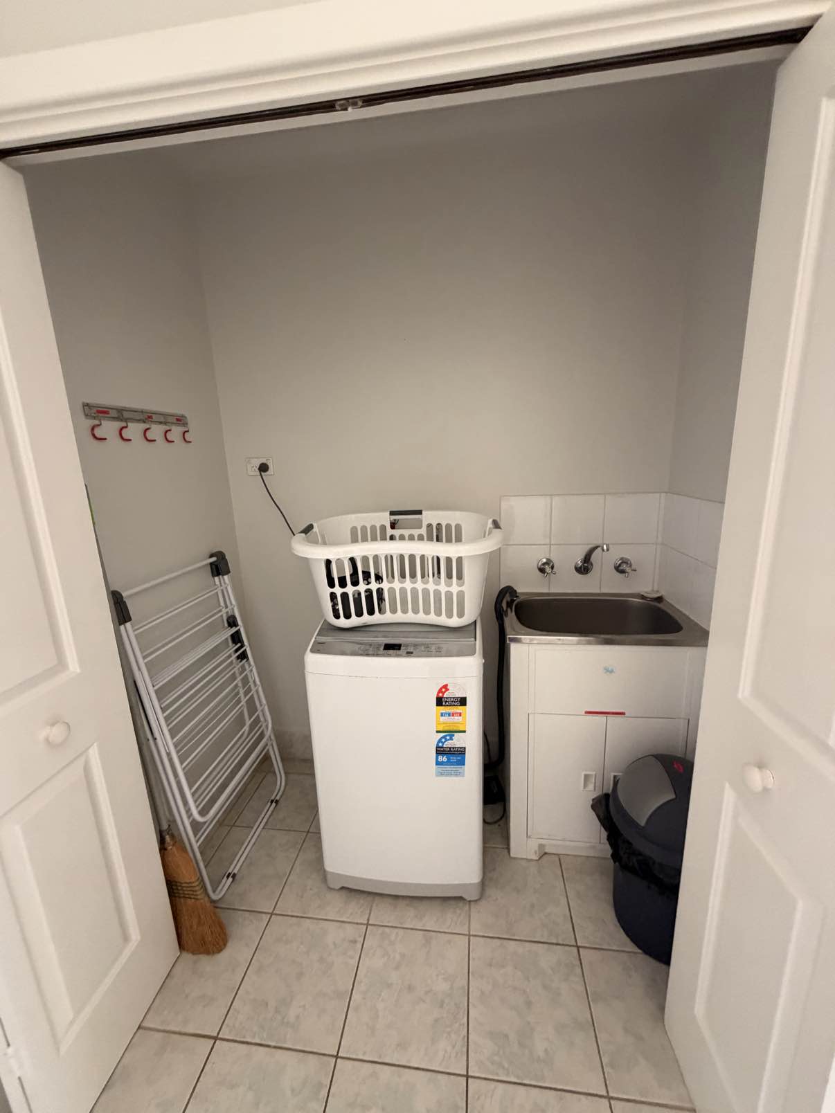 European style laundry with Top Load washing machine