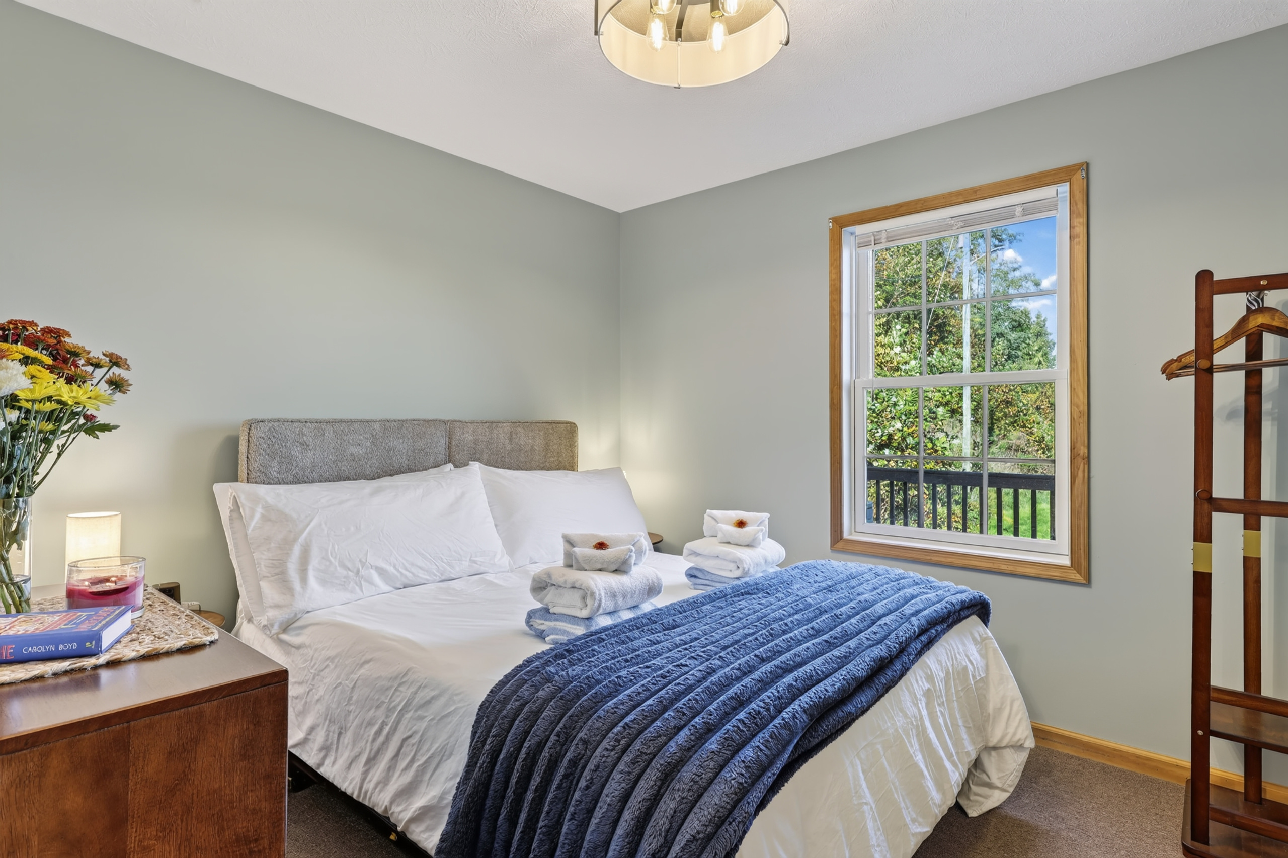 The second bedroom on the front of the house with a northern facing window overlooking the front yard and valley.