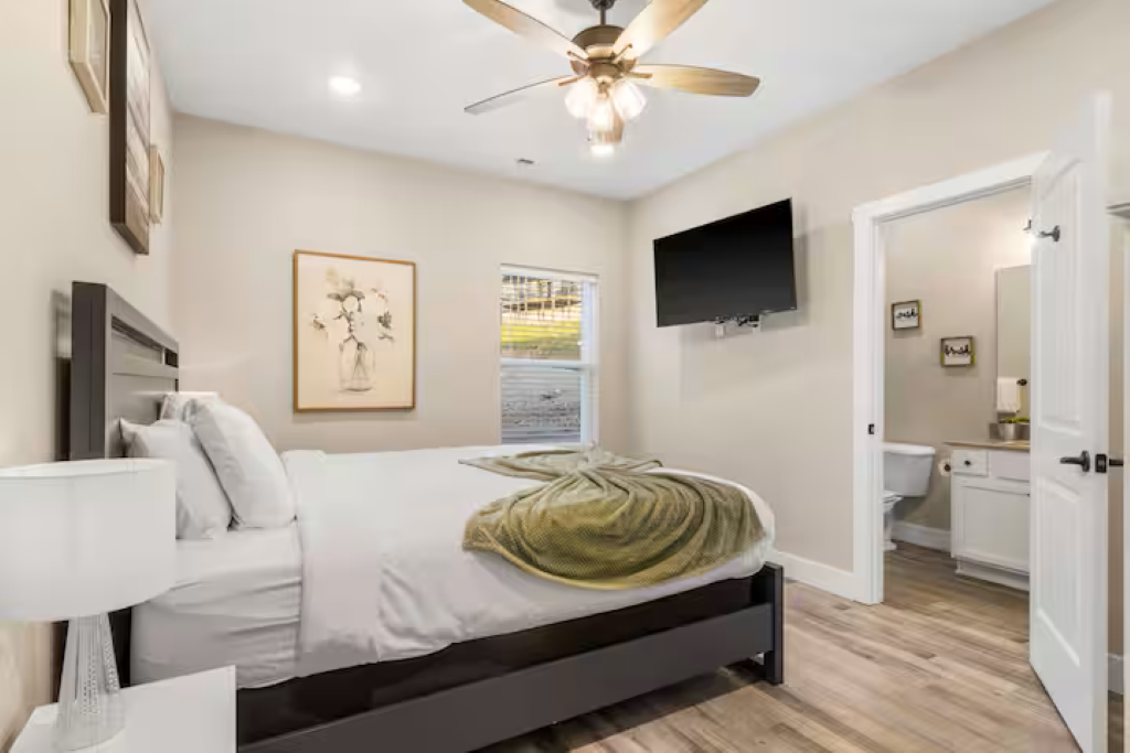 Bedroom #3 has a king size bed, TV, dresser and closet.