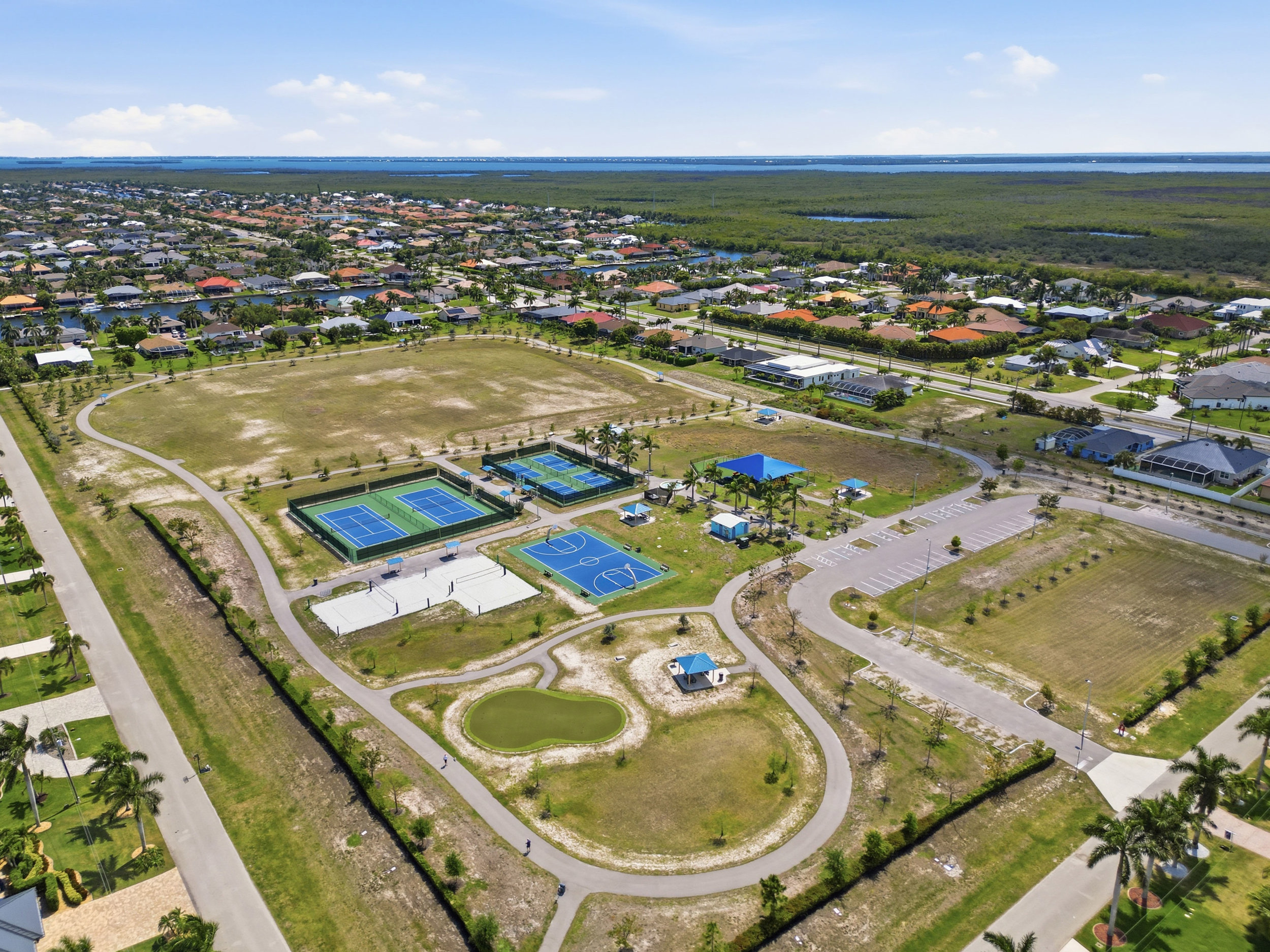 Park is across the street - beach volleyball, playground, basketball, putting green, & walking trails.