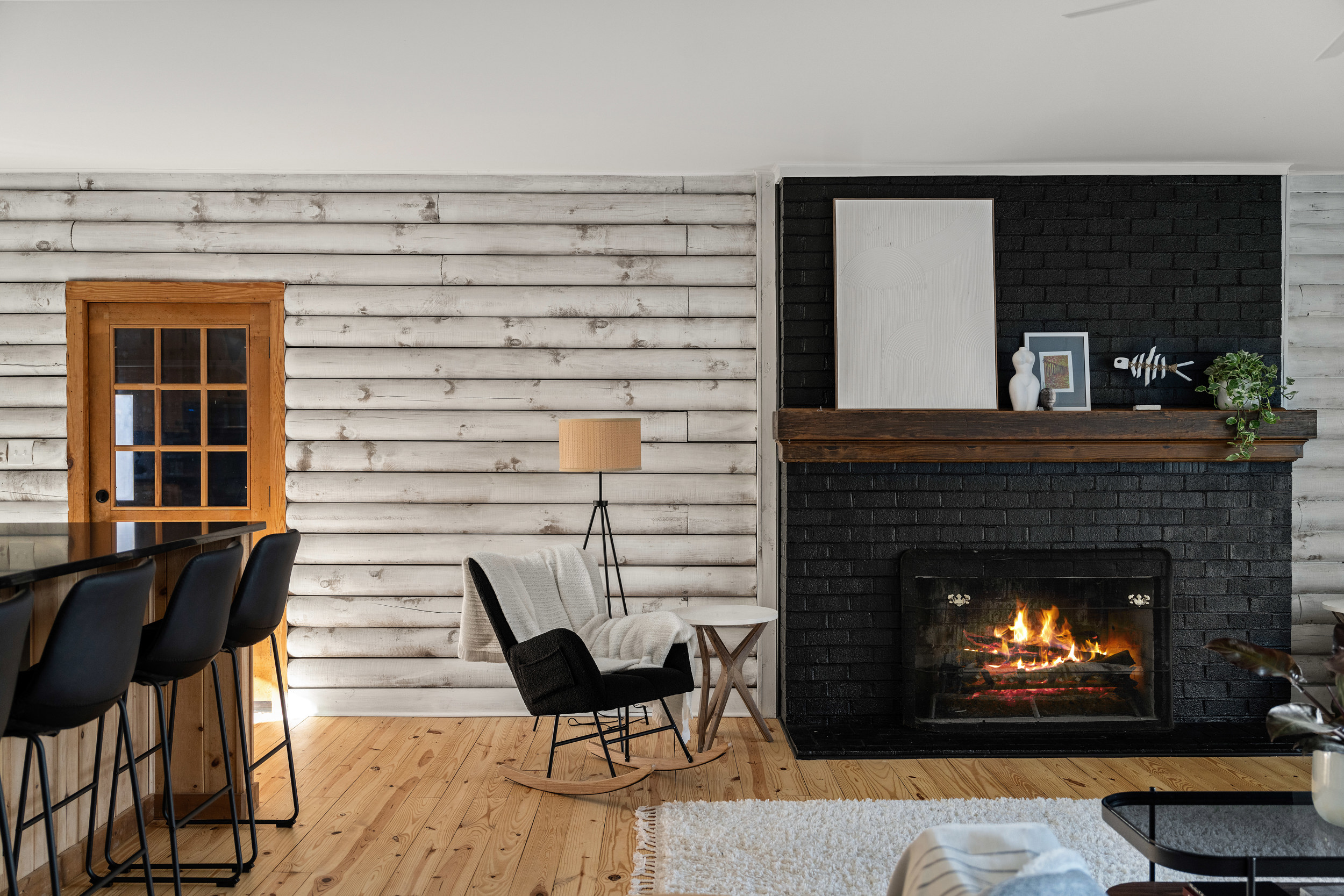 Living Room: Experience warmth by the fire in this stylish space with rustic charm and chic decor!