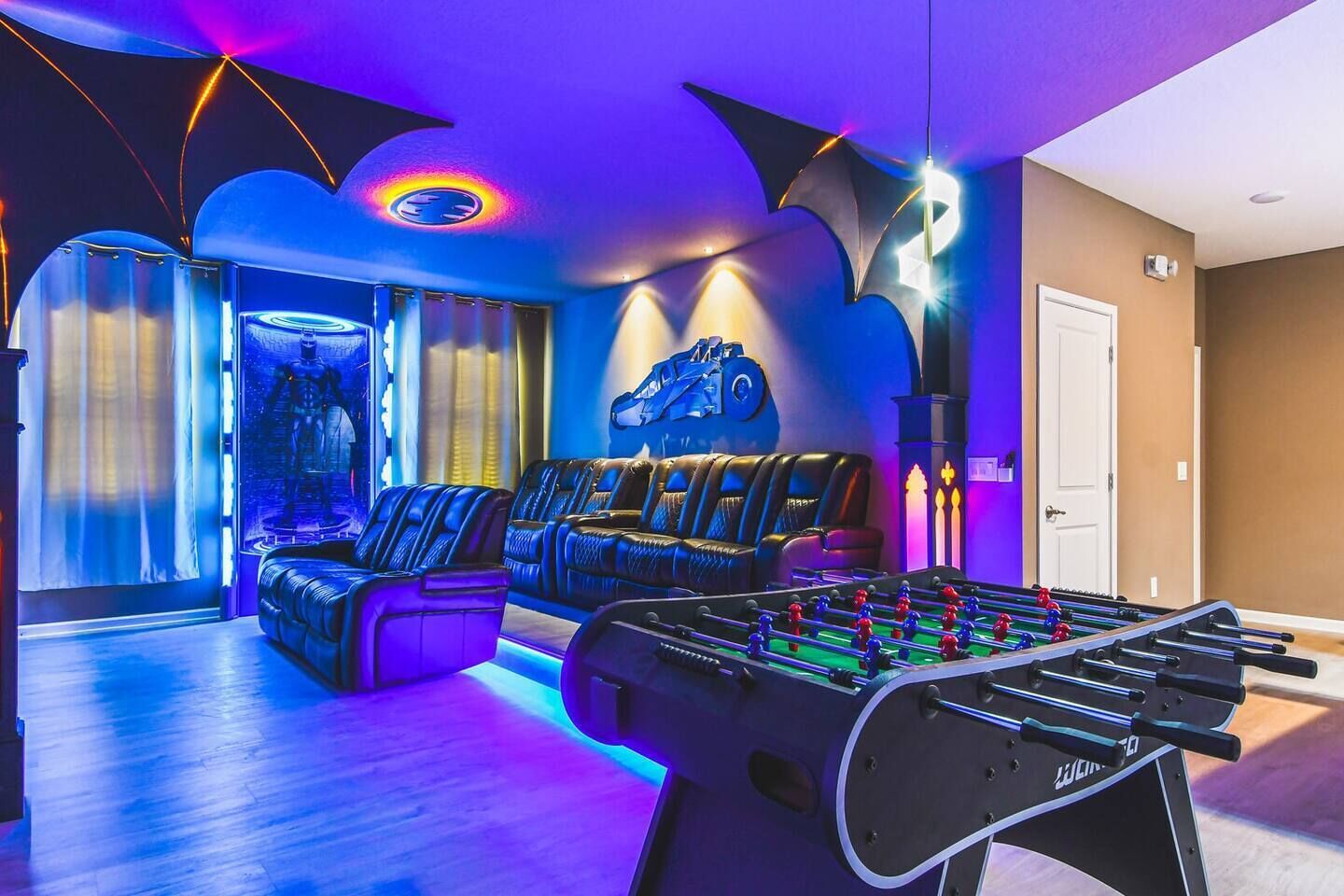 Immerse yourself in the ultimate Batman-themed movie theatre, complete with cinematic details and a foosball table for added fun between films!