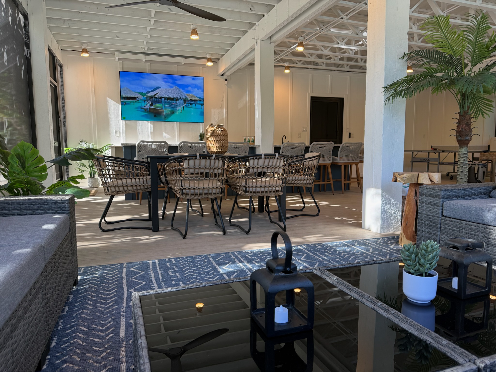 The ultimate massive screened-in lower level lounge area-85" UHD smart TV