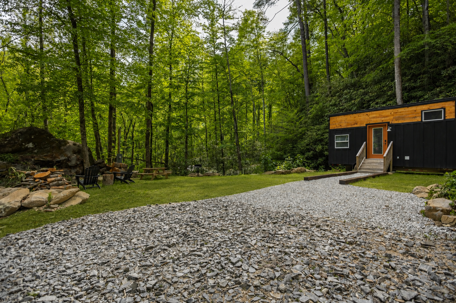 Enjoy the peaceful setting, open yard space, and cozy fire pit just steps from the bungalow.