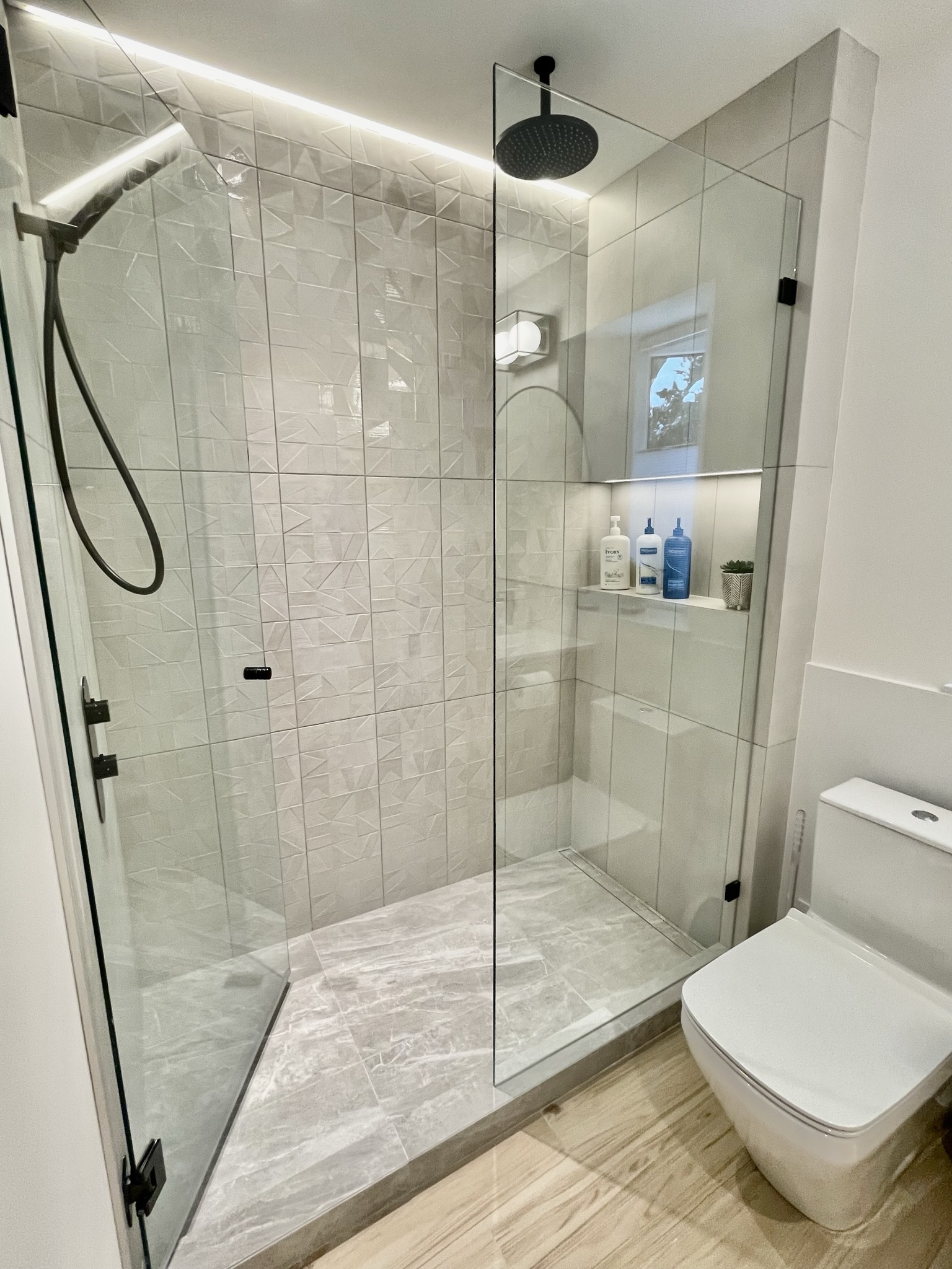 Modern Walk-in shower w/raincan showerhead + wand, heated floor Dimmable LED Accent Lighting, custom oak cabinetry 