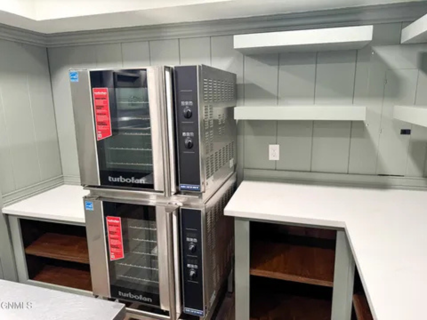 Double ovens and added counter space make group cooking much easier here.