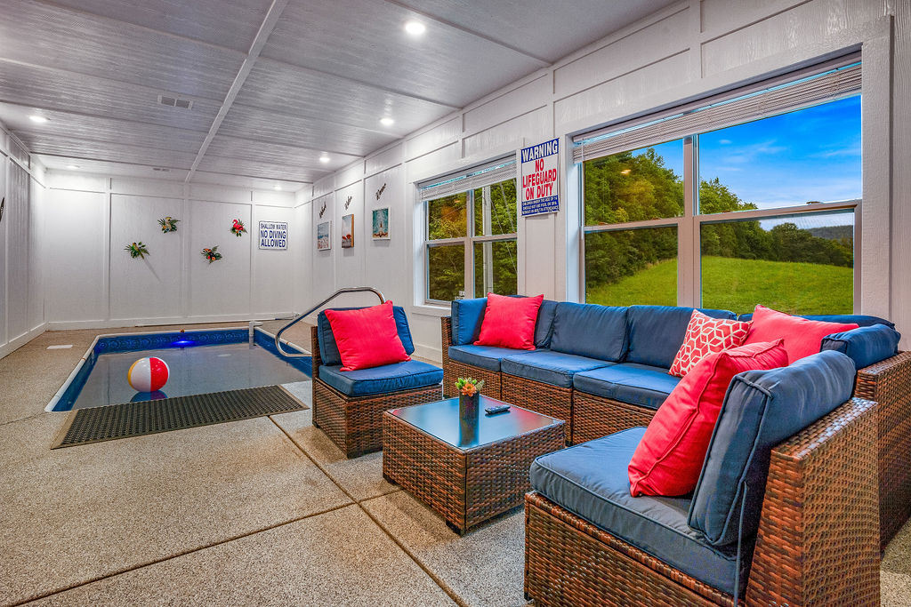 Large pool room featuring 16' X  8' indoor heating pool to 84 degrees.  Featuring a view and plenty of lounging space for parents to hangout and even catch a game on TV.  