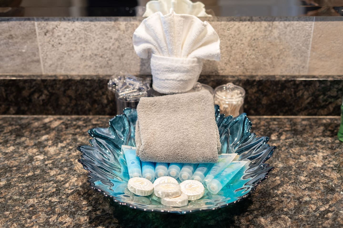 Fresh towels, soaps, and toiletries are provided and beautifully arranged — the little hotel-style touches that make you feel genuinely taken care of from the moment you arrive.