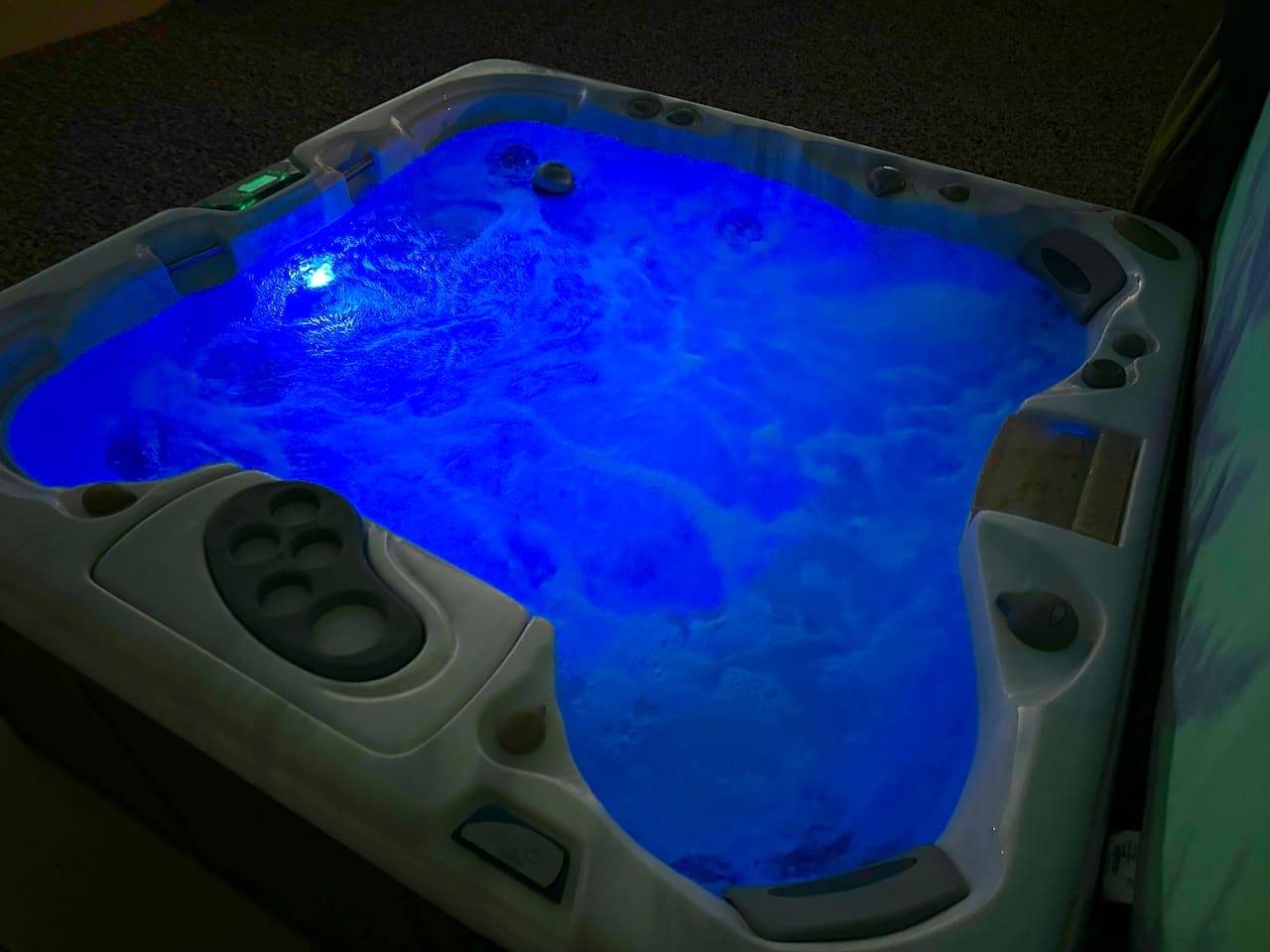Unwind in our private hot tub, perfectly situated for stargazing. The fenced backyard also features a gravel lounge area with Adirondack chairs—the ultimate spot for evening relaxation and fresh air.