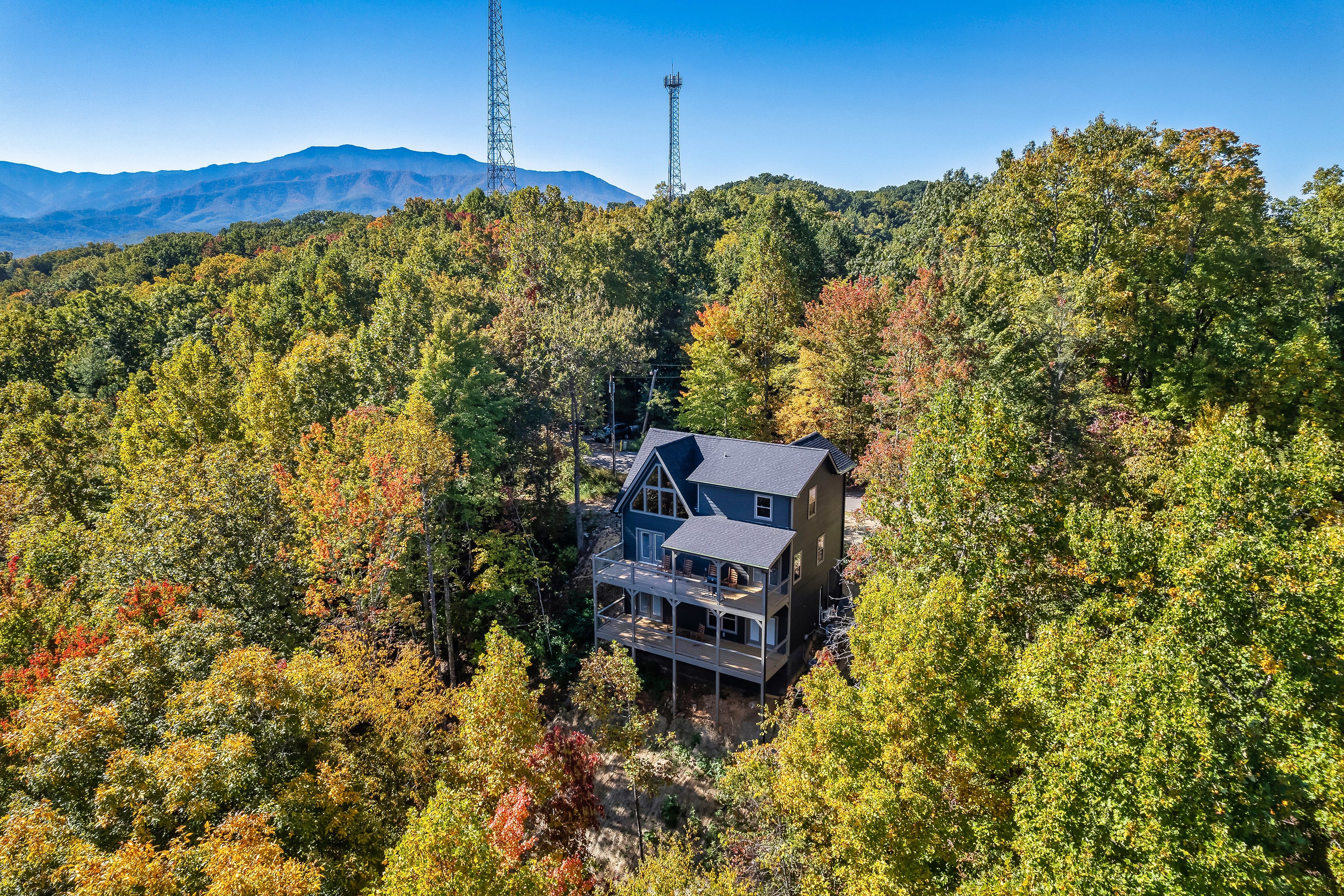 Welcome to Blue Smoke Outpost tucked among the trees with the Smokies in the distance.