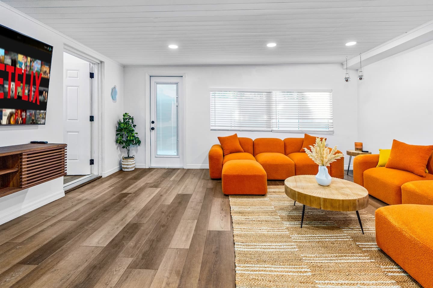 Retro living room with 75-inch LED TV.