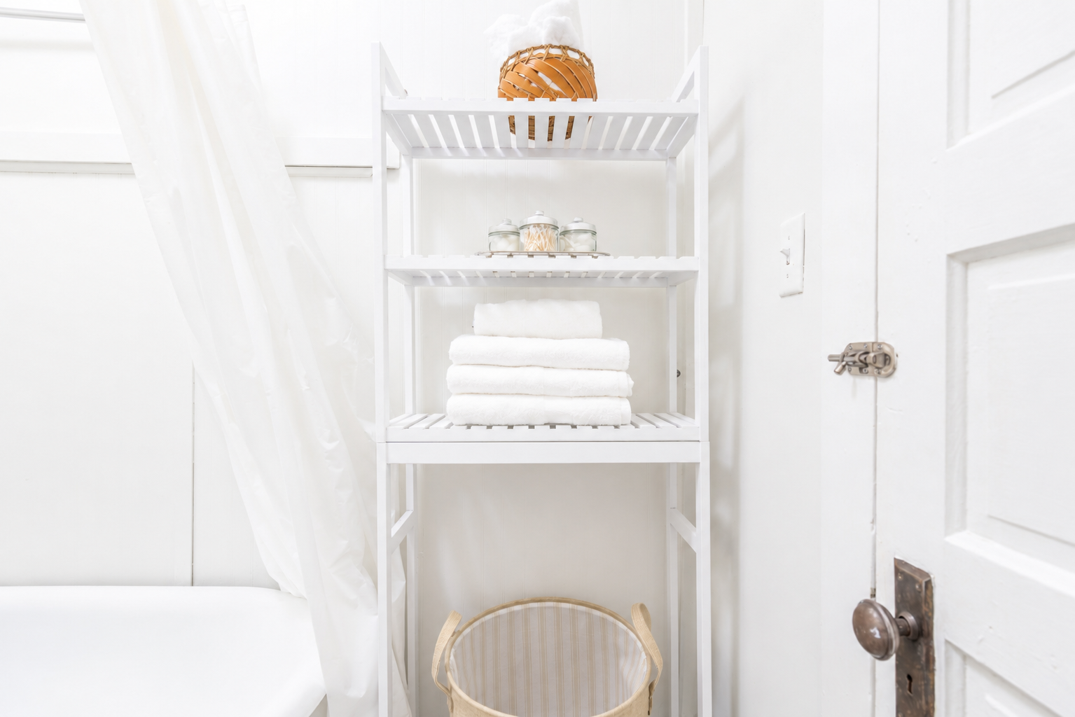 Bathroom essentials and fresh towels provided, plus a hamper to keep used linens tidy.