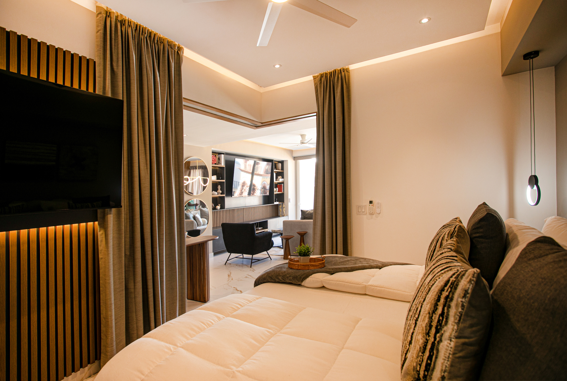 Sleep soundly with full blackout curtains, then slide them open to welcome beautiful natural light and an airy connection to the living room.