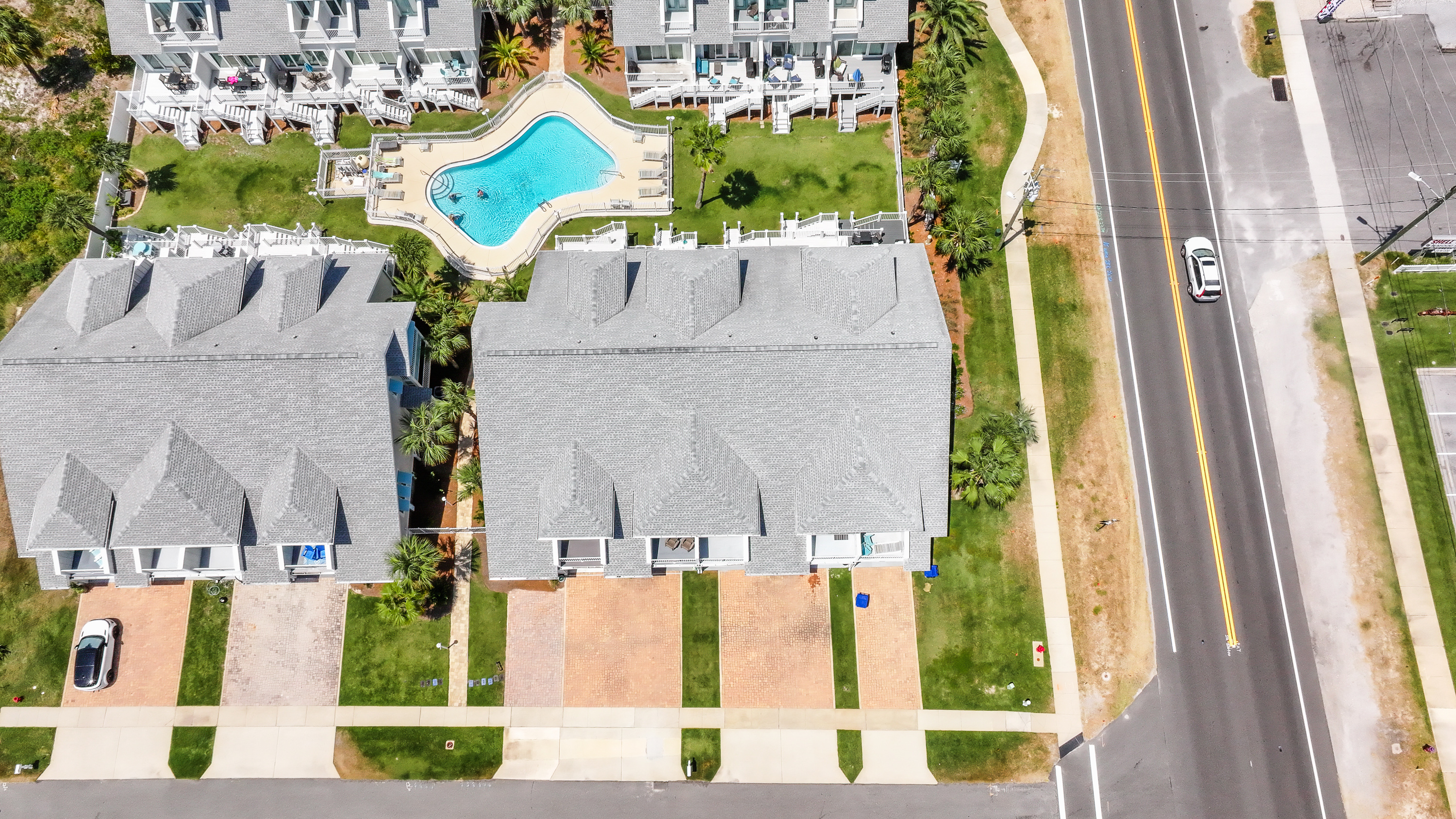 Experience resort living with a large community pool, spacious green spaces, and easy beach access