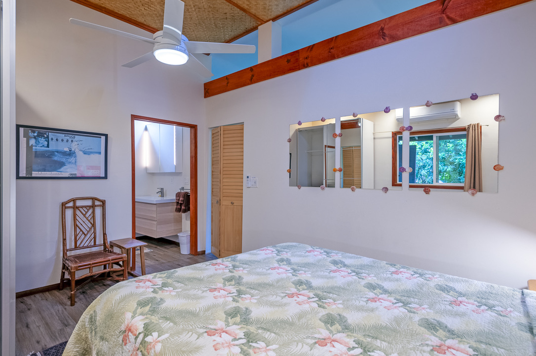 The bedroom looking toward bathroom on the left and the door to the Living Room on the right