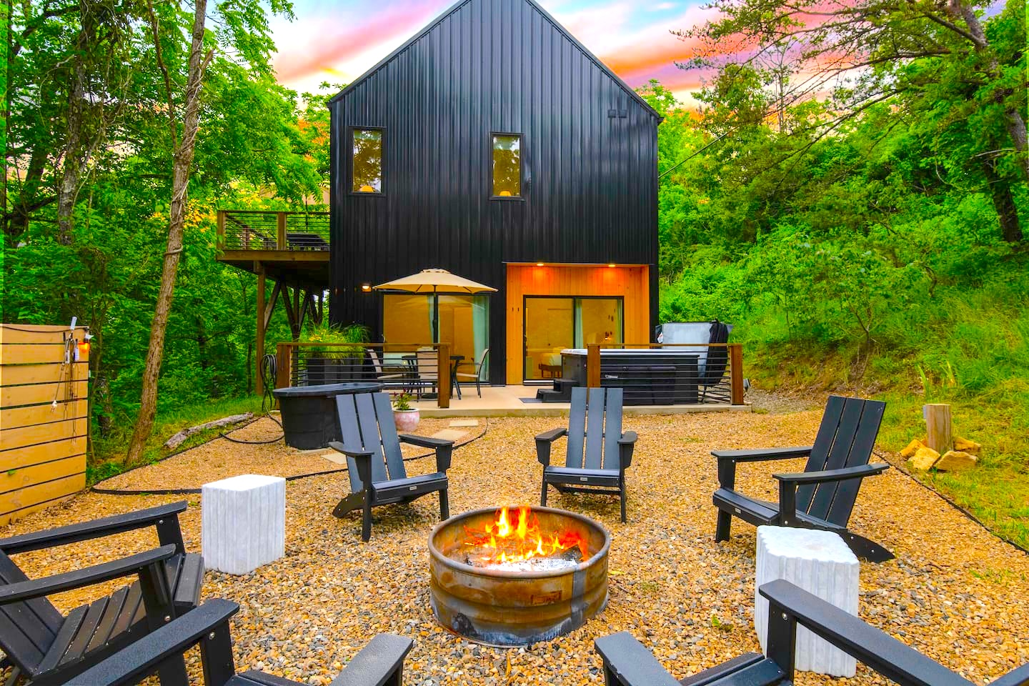 {Backyard} Enjoy a wood burning fire pit, hot tub, and cold plunge.