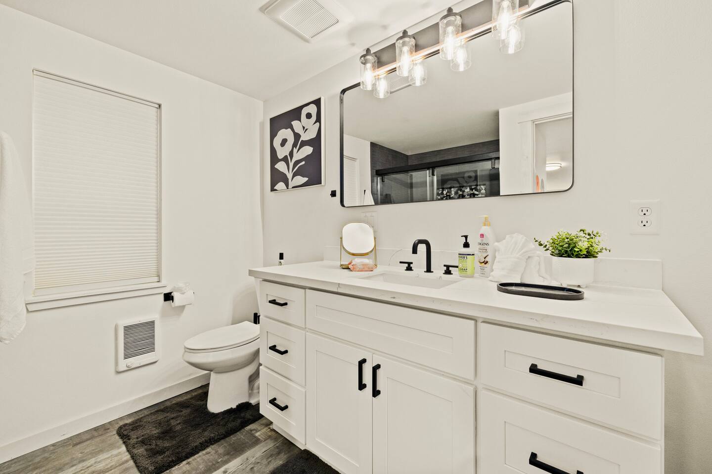 Bathroom #1 is downstairs and has a shower area with sliding doors. Comes fully stocked with high quality body wash, shampoo, and conditioner