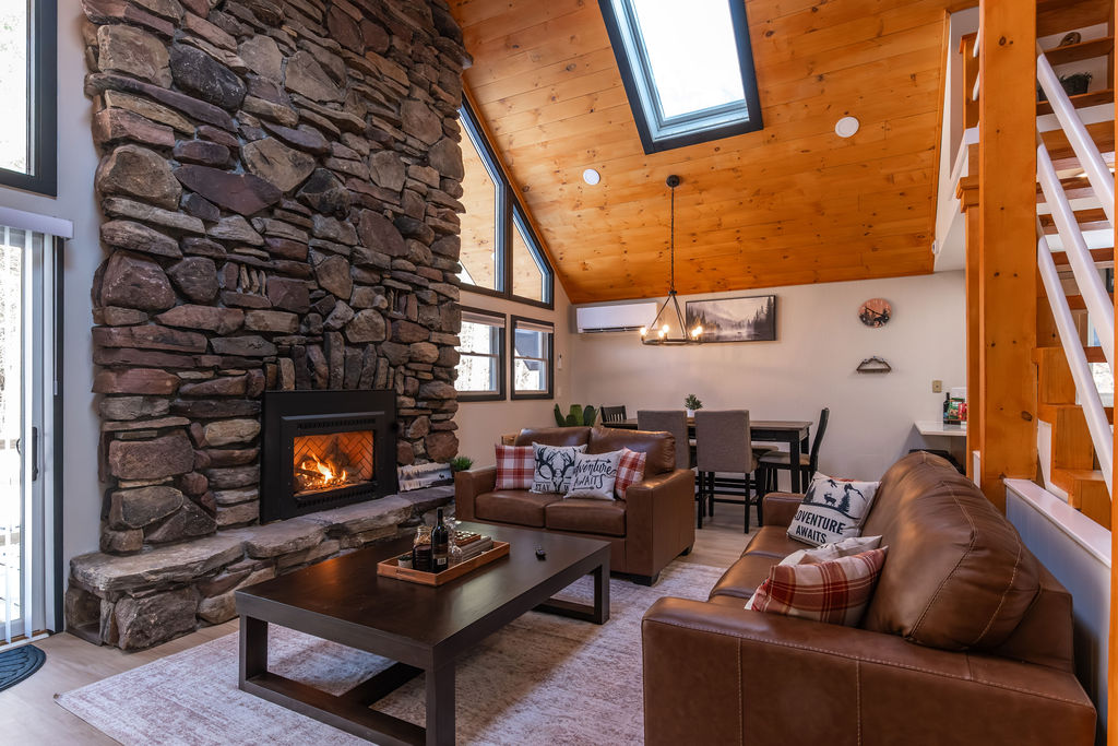 Decompress with friends and family after a day of adventure and cozy up by the fireplace, and enjoy the view of the outdoors with our sliding glass door facing the deck!