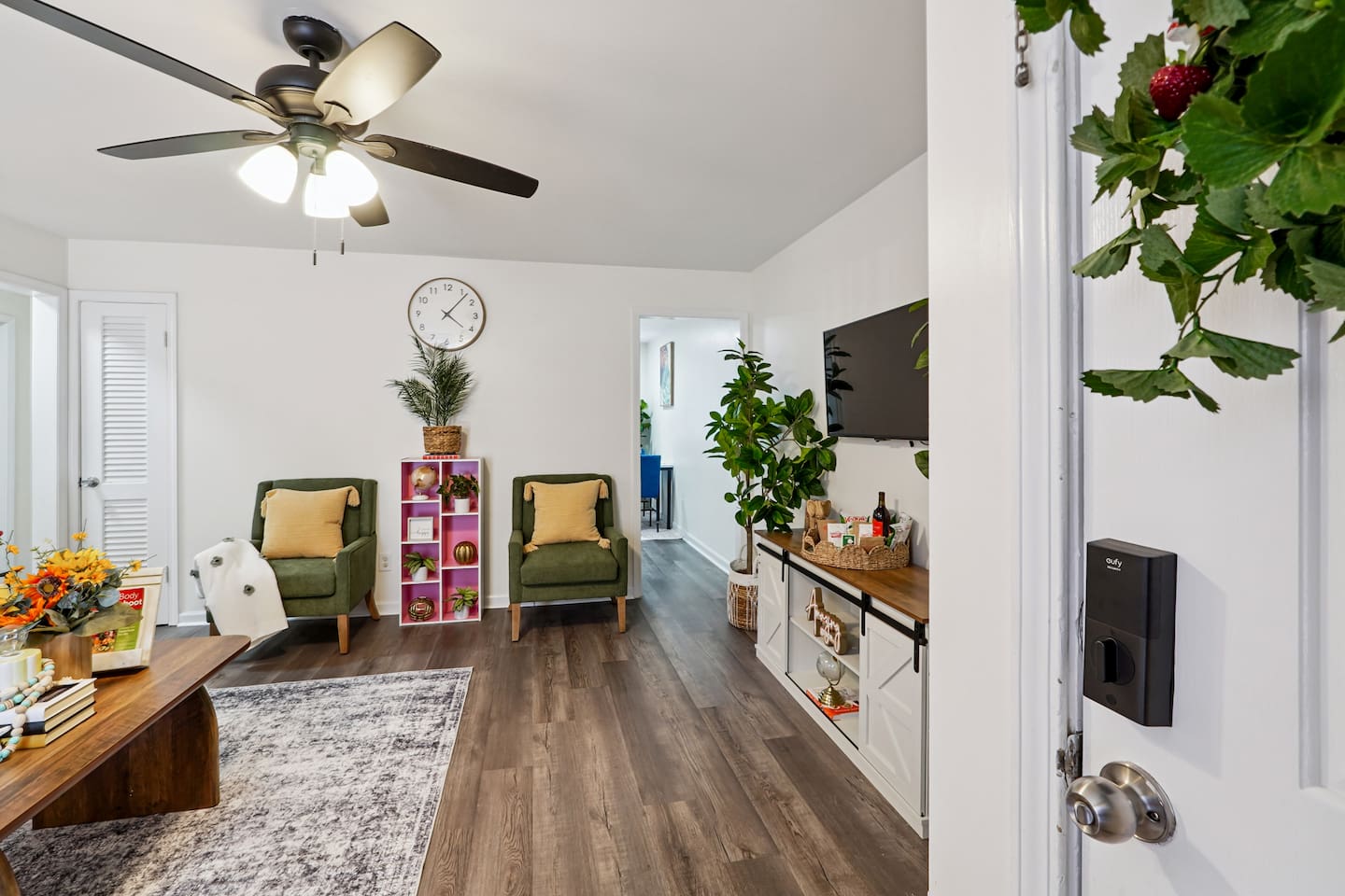 The living room features cozy furniture, including a comfortable blue couch, and an Amazon Fire-powered Smart TV for your entertainment. You’ll also find the Xfinity modem conveniently located here, convenient for ethernet connection.
