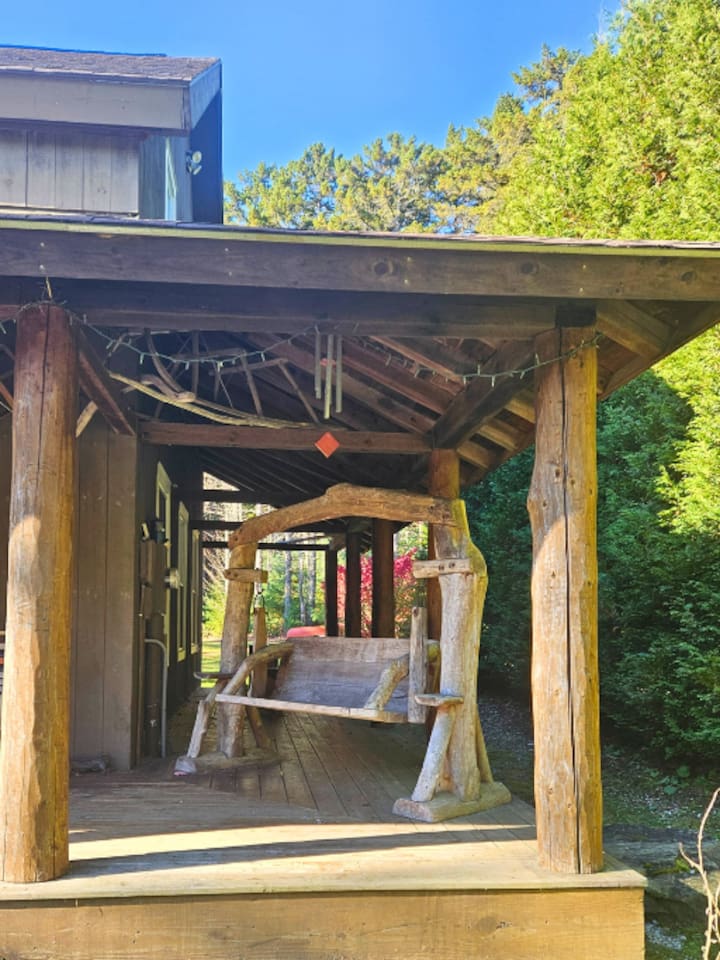 Enjoy the views from this amazing hand carved wood swing after a long soak in the hot tub! 