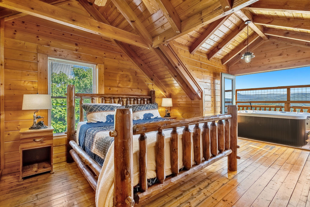 Enjoy a restful escape in this inviting suite, complete with a king bed, TV, private ensuite with a shower/tub combo, and direct access to a private deck overlooking the Smoky Mountains.