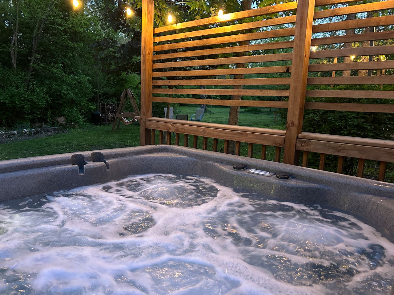 Relax in hot tub under the glow of the cafe lights.