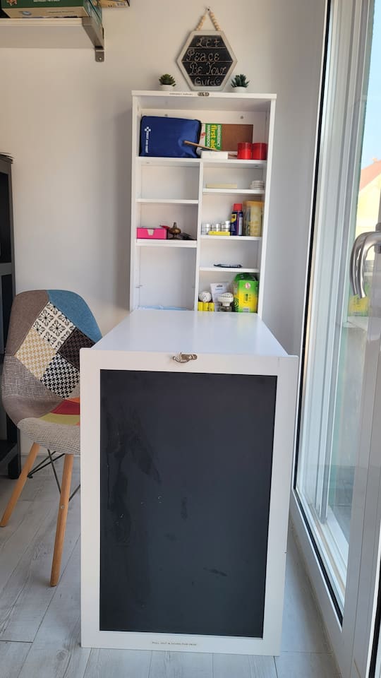 Converted desk workspace, location of the First Aid Kit and other emergency supplies