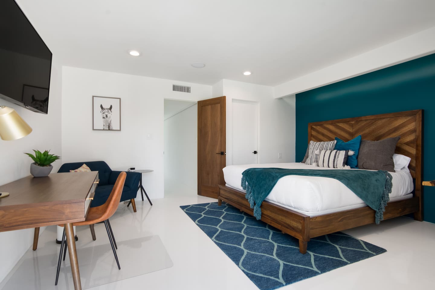 Master bedroom with walk-in closet, private slider to pool, and ensuite bathroom