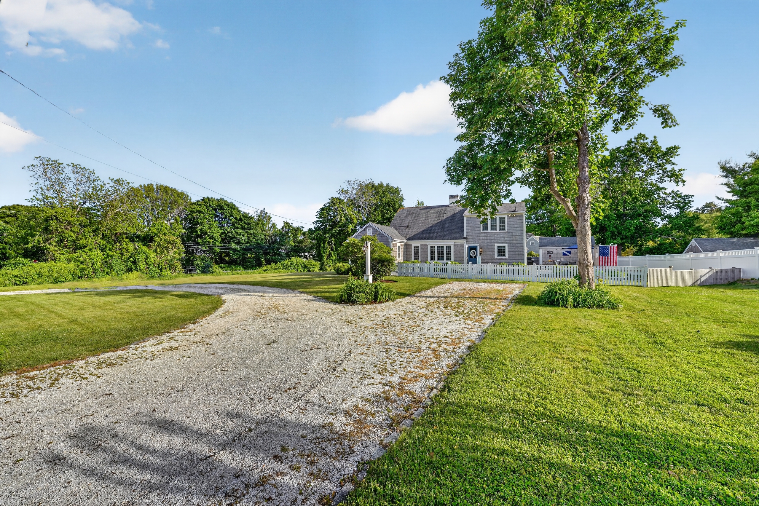 Long private driveway with ample parking and easy access to the home, offering plenty of space for multiple vehicles.