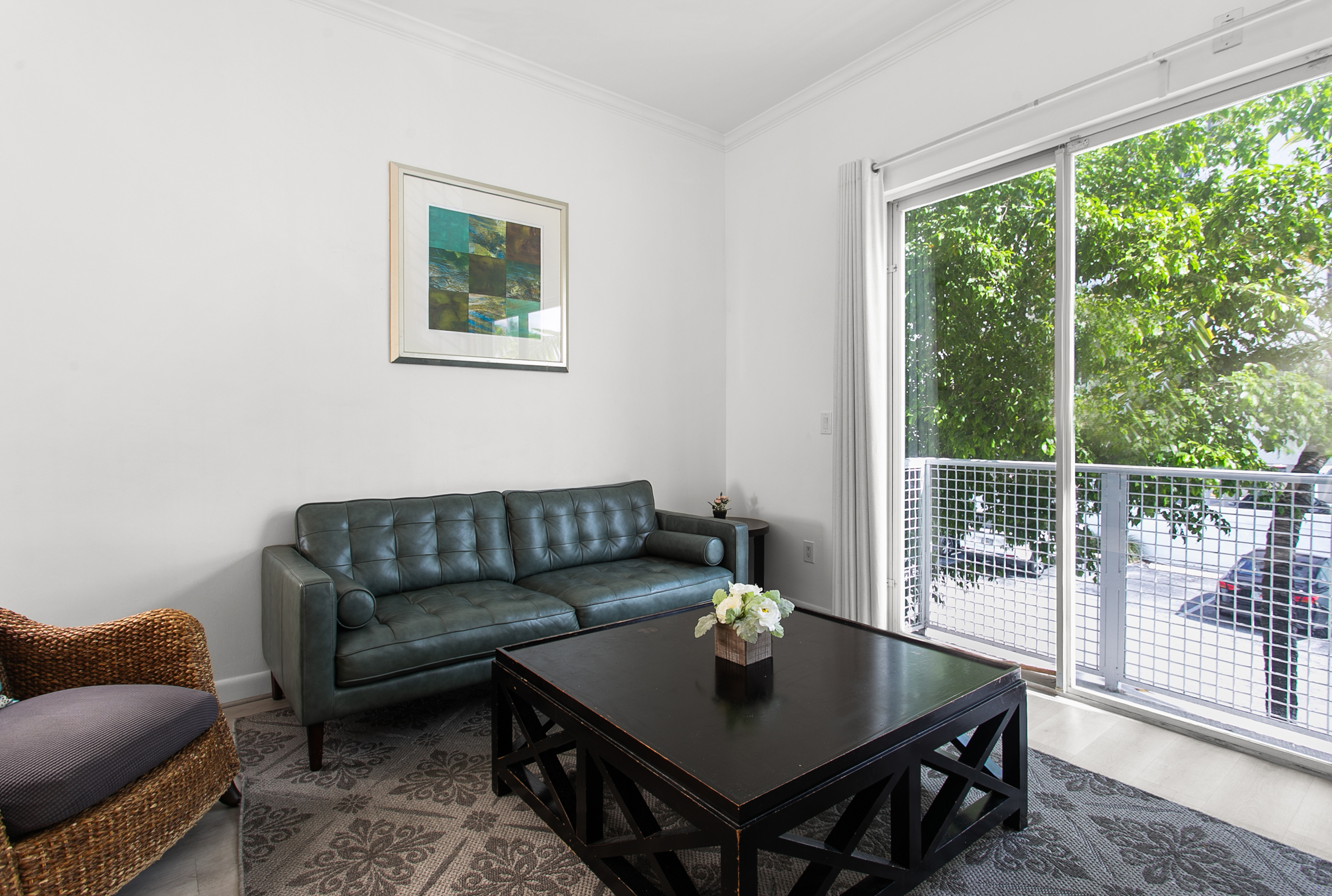 Sliding glass doors open for sea breeze and fresh air, especially nice in winter