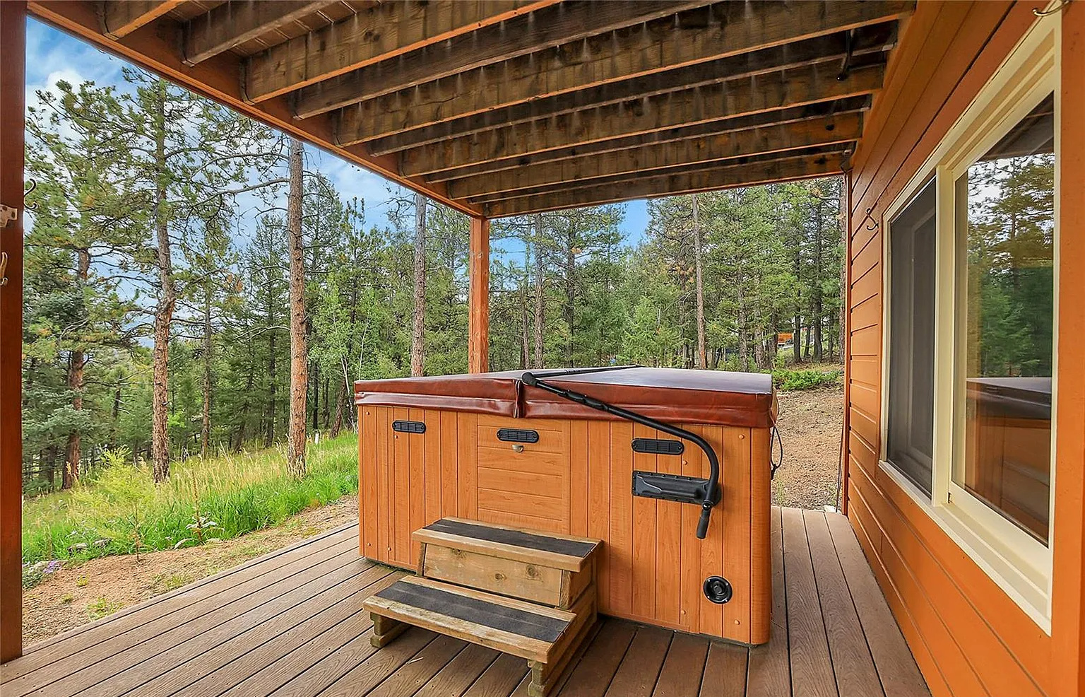 Soak away your stress in the private outdoor hot tub while taking in the crisp mountain air and surrounding nature.