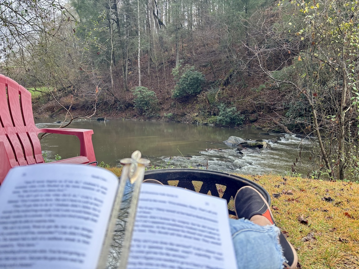 A good book and the sound of a cascading waterfall makes for a great day!