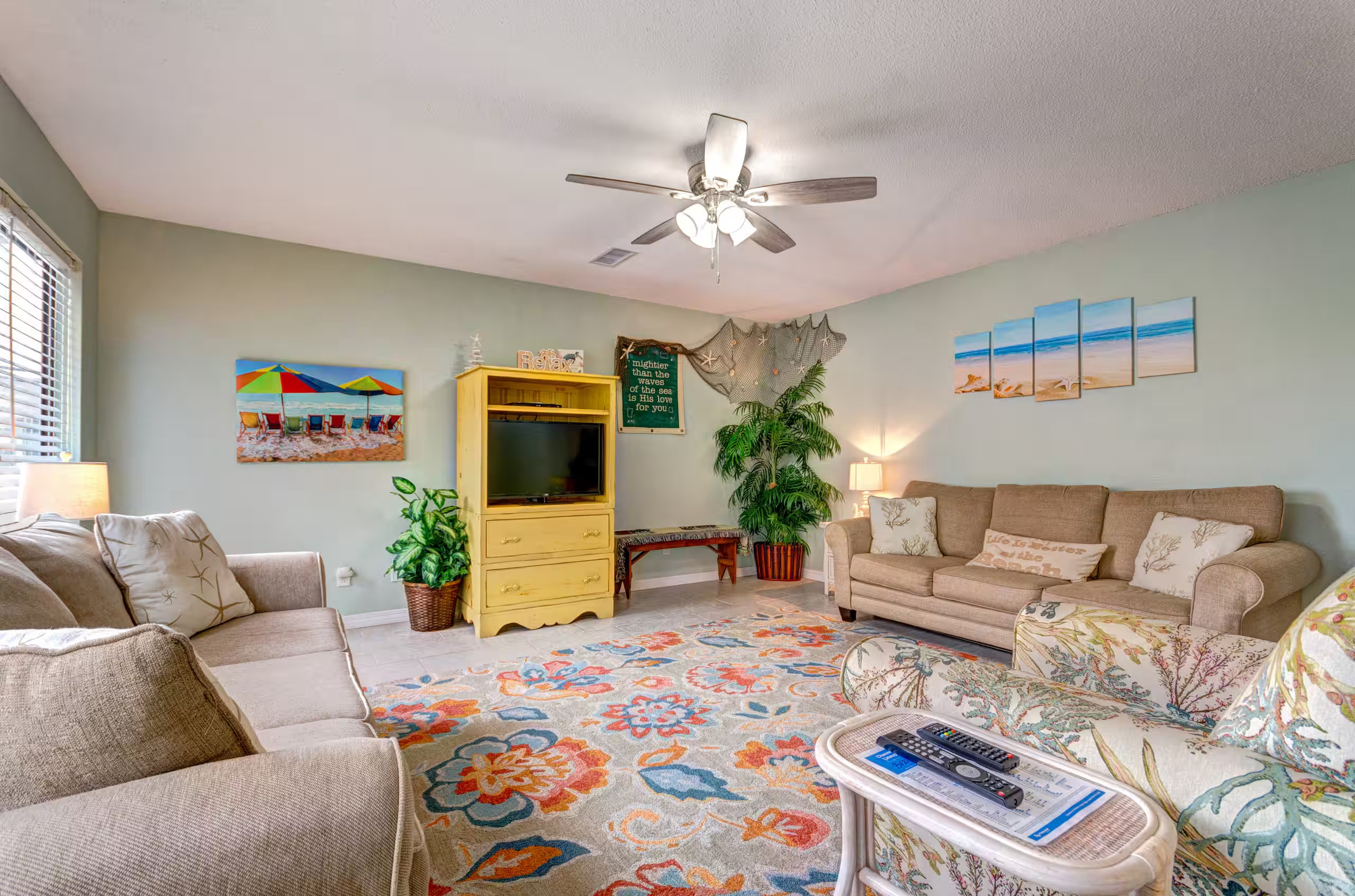 Bright, airy, and comfortable living room with seating for the whole group to relax. Just steps from the kitchen and dining area, it's  perfect for movie nights or unwinding after the beach.