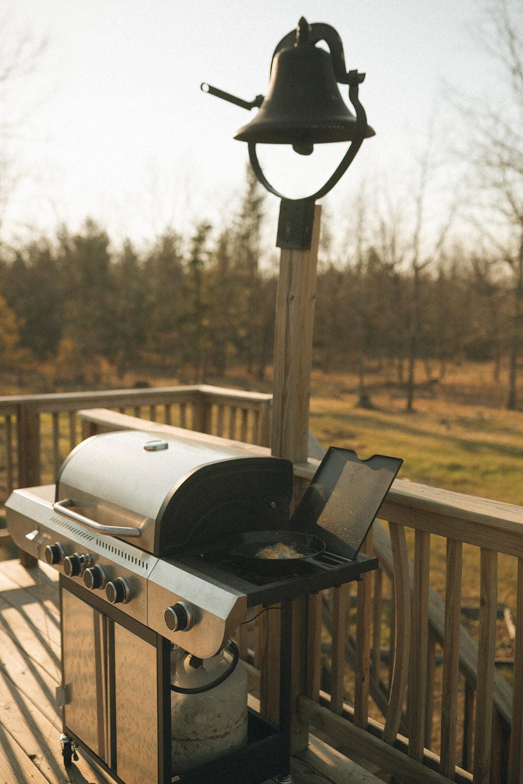 Propane gas grill on the deck off of the dining area