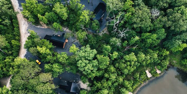 Aerial view showcasing the wooded setting