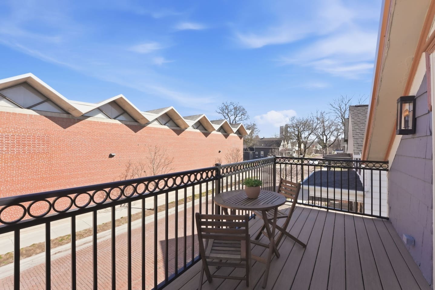 Cozy outdoor deck with table and chairs, ideal for relaxing and taking in the surroundings