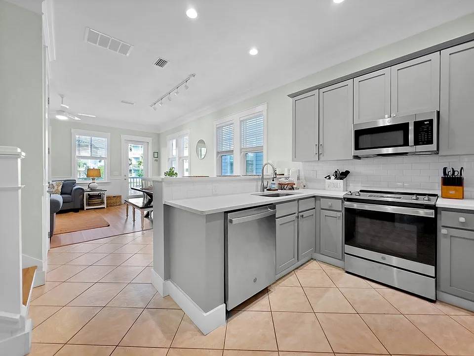 Open floor plan and tall ceilings make the home bright and feel spacious.